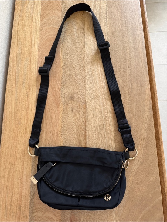 lululemon athletica Handbags - lululemon athletica Black Crossbody Pouch with Gold Hardware